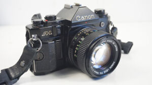 Canon A-1 35mm Black SLR with Lens FD 50mm f 1: 1.4 and gadget bag