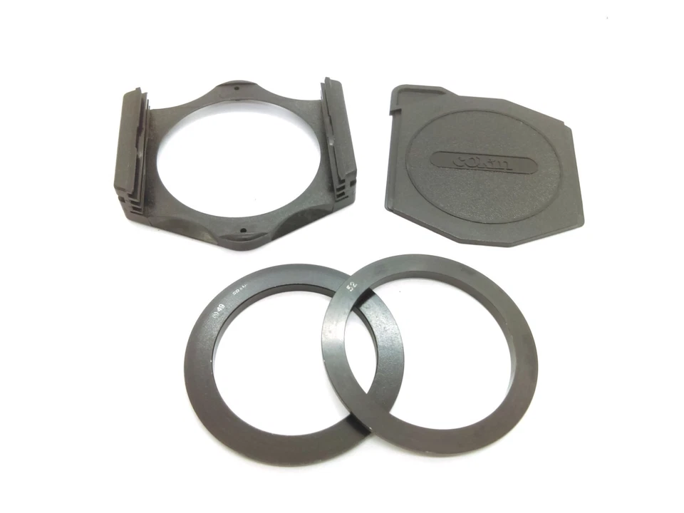 COKIN A Set of Filter Holder, Cover, 49mm Adapter Ring, and 52mm Adapter Ring - Image 1 of 1
