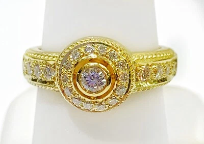 Anillo de diamantes con halo de 18 quilates Foto 1 de 4