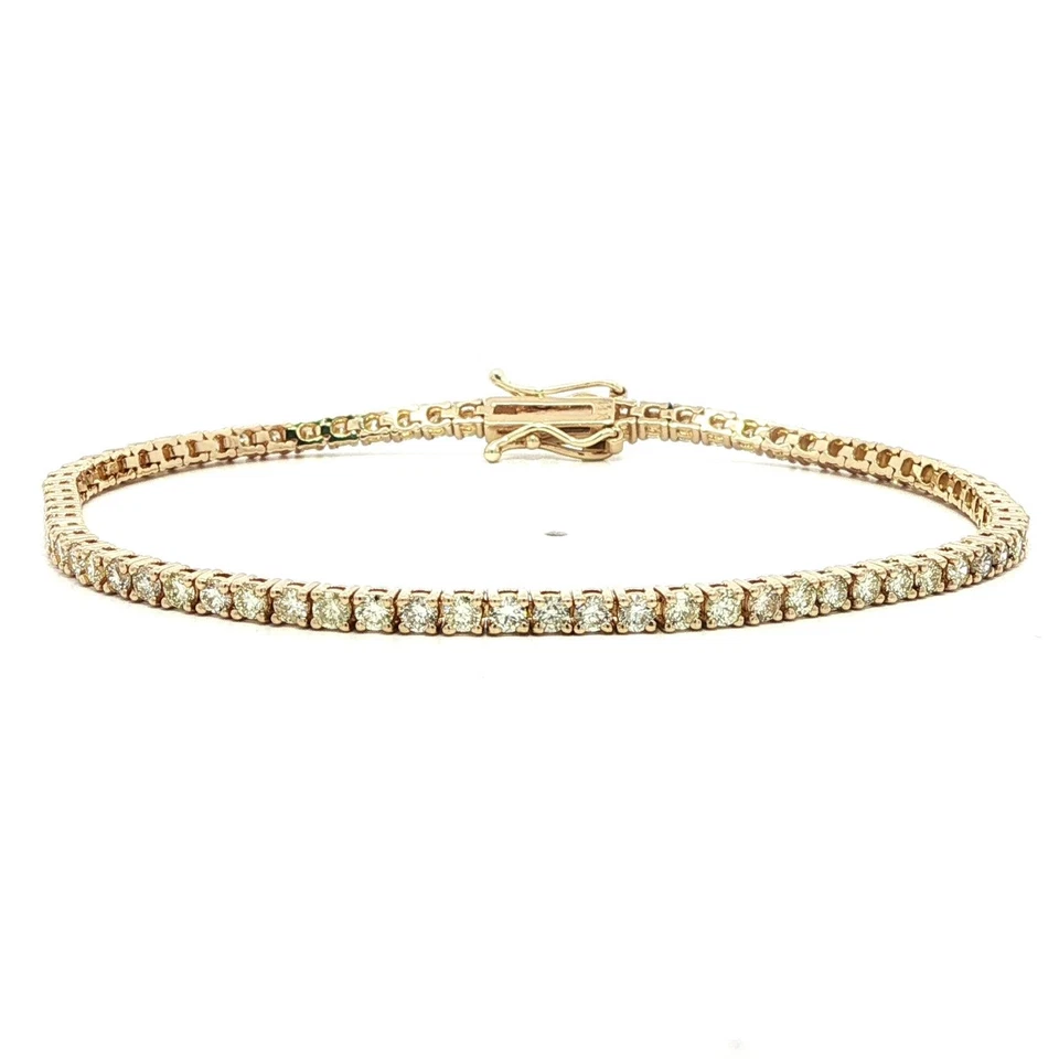 Brazalete de tenis de línea clásica de diamantes brillantes ardientes de 2,92 quilates de oro amarillo de 14 k Foto 1 de 4