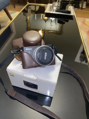 Nikon 1 J1 10.1MP Digital Camera - White (Kit w/ VR 10-30mm Lens) and Body Grip - Image 1 of 4