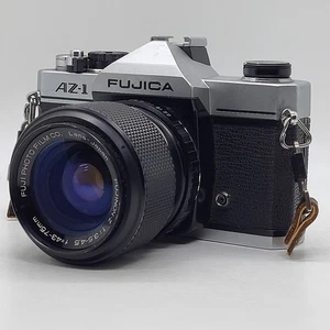 Fujica AZ-1 fotocamera reflex pellicola con Fijinon Z 43-75 mm f3.5-4.5, Giappone, testata ex condizioni - Foto 1 di 21