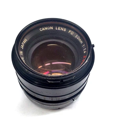 Canon FD 50mm 1:1.4 S.S.C. Camera Lens w/Minolta 1A F55NA Filter Made In Japan - image 1 of 4