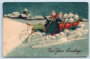 New Year Greetings Kids Driving Clock Car with Bags of Money c1910 Postcard - Picture 1 of 2
