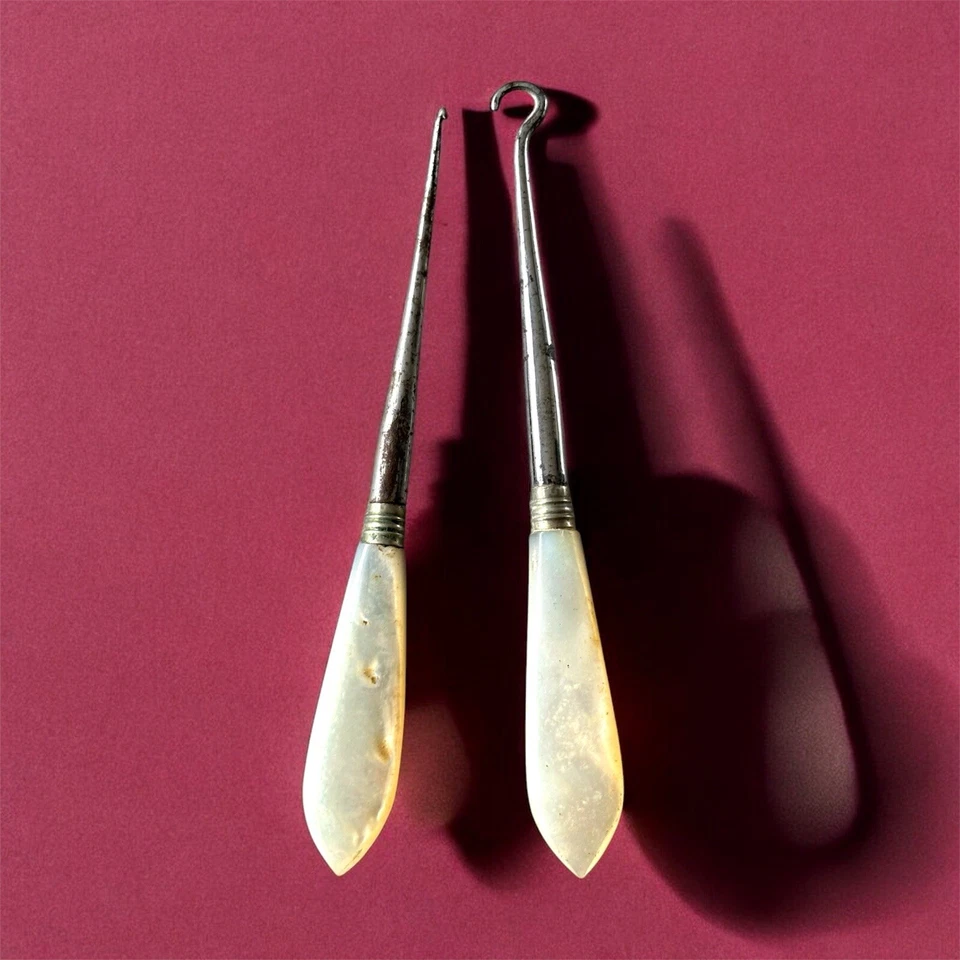 antique button hooks with mother of pearl handles - Image 1 of 1