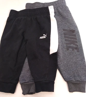 Lote de 2 PANTALONES DEPORTIVOS PUMA & NIKE Talla 2T NIKE/GRIS, PUMA/NEGRO Foto 1 de 3