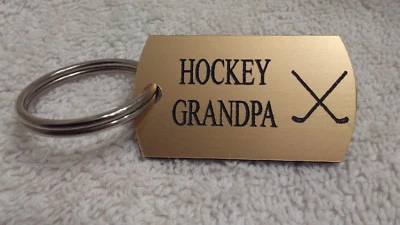 Hockey sobre hielo abuelo plástico oro llavero etiqueta LJB joyería atlética nuevo abuelo Foto 1 de 4