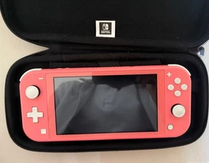 Nintendo Switch Lite Coral and Case - Picture 1 of 3