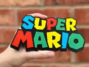 Super Mario Logo insegna colorata arte 3D accessorio da scrivania - Imagen 1 de 4