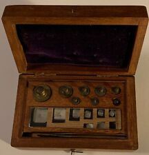 BRASS APOTHECARY PHARMACY WEIGHTS IN WOODEN BOX SET RANGING IN SIZE FROM 50 T