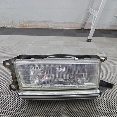 Conjunto de faros delanteros izquierdo del lado del conductor Toyota Cressida 1985-1988 MX73 FABRICANTE DE EQUIPOS ORIGINALES Foto 1 de 4