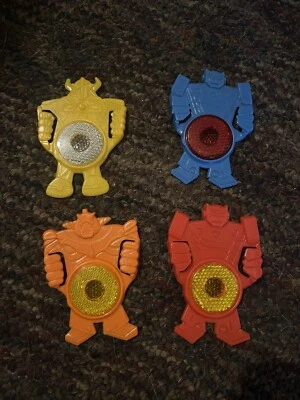 1985 KELLOGG'S ROBOT BIKE REFLECTOR TRANSFORMERS-set of 4 Foto 1 de 2