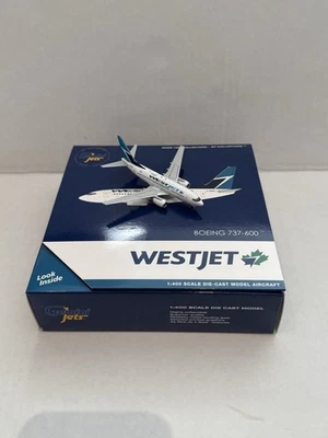 RARO Geminijets 1:400 WestJet 737-600 C-GWSL (25 aniversario) Foto 1 de 4