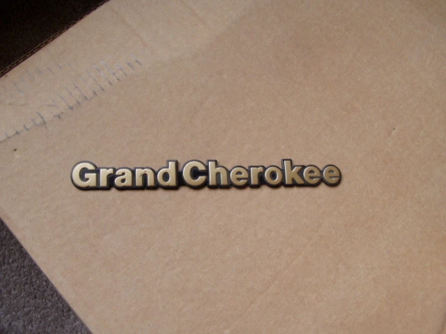 1993 1994 1995  1996 1997 1998 Jeep Grand Cherokee nameplate emblem GOLD 93 98 - Image 1 of 1