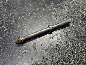 1981 Honda CM400E CM400 E original COMPLETE FRONT AXLE w WHEEL SPACER - Picture 1 of 9