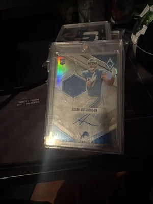 2022 Lions Aidan Hutchinson Panini Phoenix Silver RPA /299 - Image 1 of 3
