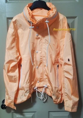 Nuevo cortavientos Free People naranja claro de nailon con capucha oculta talla M Foto 1 de 4