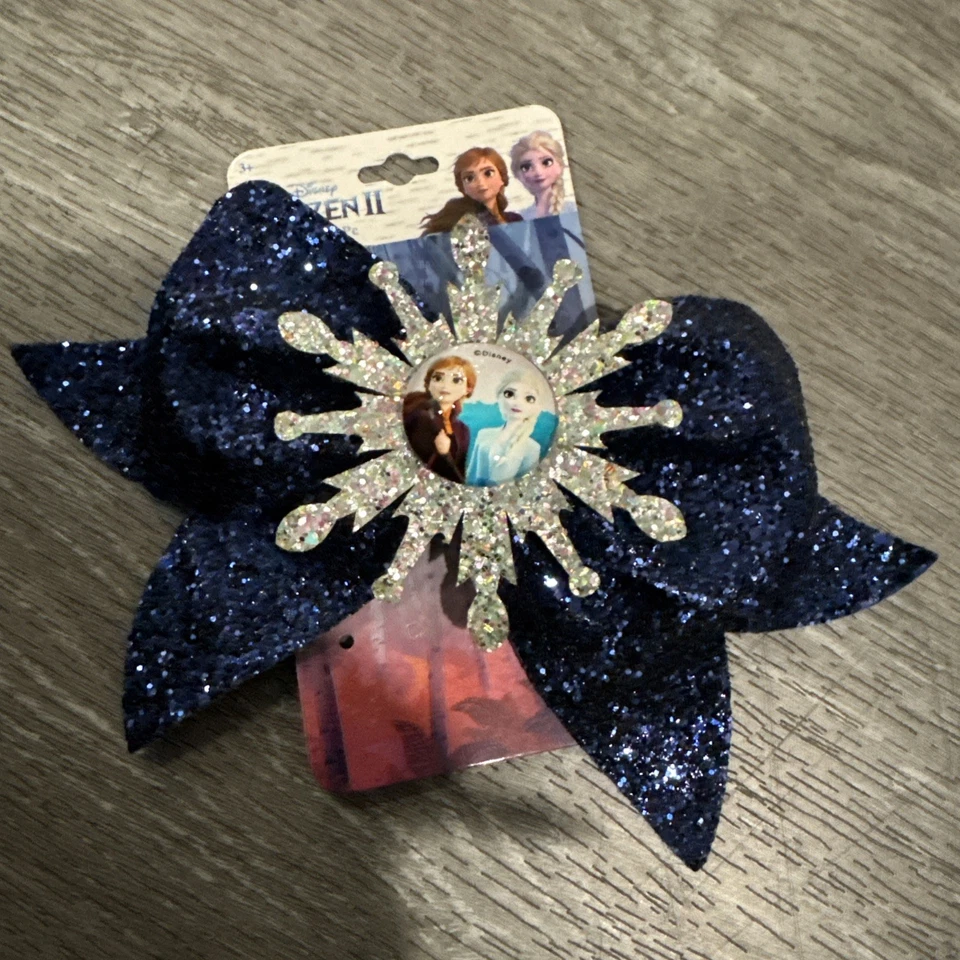 NWT DISNEY FROZEN II LARGE BLUE GLITTER SNOWFLAKE BOW (W/ SALON CLIP) - Image 1 of 4