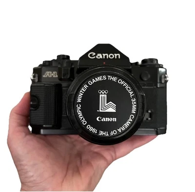 Canon A1 35mm SLR Film Camera w/Canon 50 mm 1:1.4 Lens & 1980 Olympic Lens Cap - Image 1 of 4