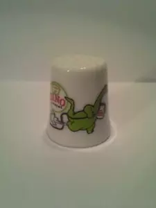 Up4Bid Dino Sinclair Benzin Sammlerstück Porzellan Fingerhut - Bild 1 von 1