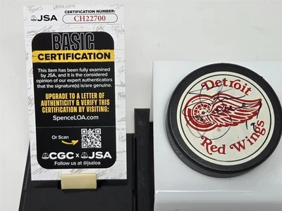 STEVE YZERMAN signed RED WINGS official game puck JSA COA - Image 1 of 2