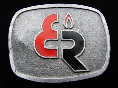 RF13101 VINTAGE AÑOS 70 **LOGOTIPO DE EMPRESA DESCONOCIDO** PUBLICIDAD PELTRE CINTURÓN HEBILLA Foto 1 de 2