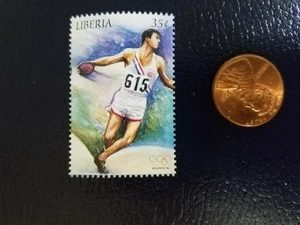 Sello perforado Bob Matias USA Discus medalla de oro Juegos Olímpicos Liberia - Imagen 1 de 1