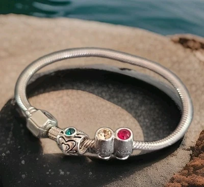 Pulsera CHAMILIA de plata de ley con 3 dijes Pino Grigio, Pino Noir, etc. Foto 1 de 4