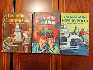 LOT OF 3 BRAINS BENTON MYSTERY HC COIN ROLLS DRAGON 1960-61 GEORGE WYATT - Picture 1 of 11