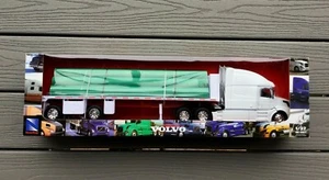 NEWRAY 1/32 WHITE VOLVO TRANSPORT TRUCK & FLATBED TRAILER W/ PIPE LOAD 14223 NIB - Picture 1 of 12