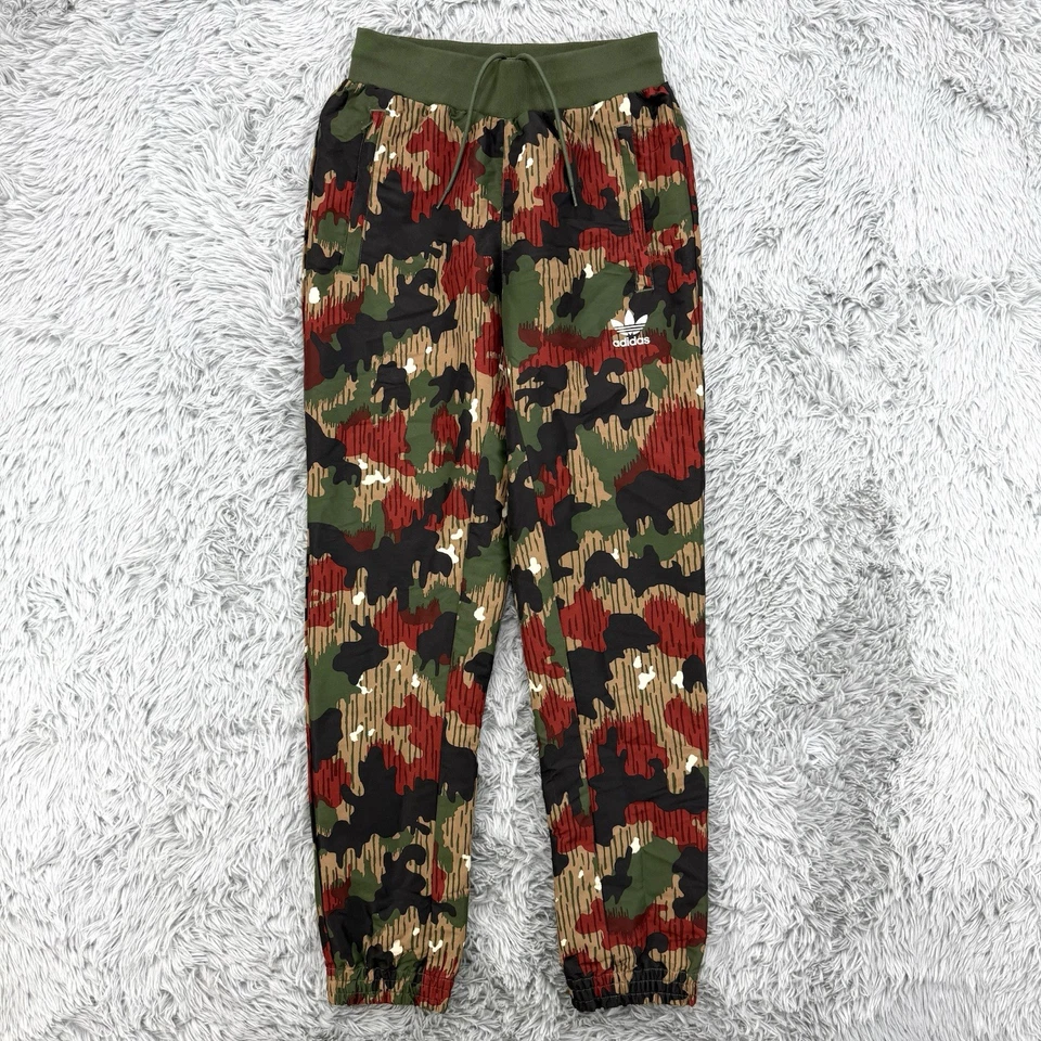 Calça Adidas x Pharrell Williams Masculina S Camo Hu Caminhada Calça de Vento Forrada Trilha - Imagem 1 de 4