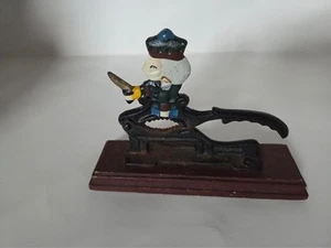 Vintage Cast Iron Figural Nutcracker Novelty Figure on Wood Base - Picture 1 of 7