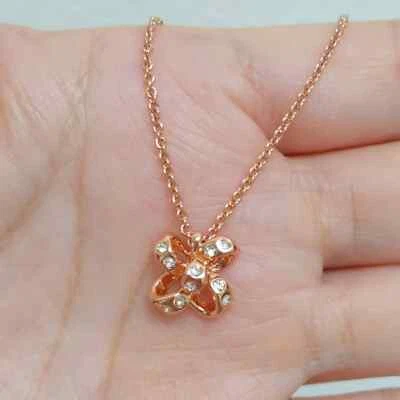 Collar colgante con lazo pavimentado de oro rosa Kate Spade nuevo con etiquetas Foto 1 de 4