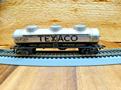 Atlas HO Scale 40' TEXACO T.C.X. 270 Weighted Tri-Dome Tank Car w/ Sprung Trucks - Image 1 of 4