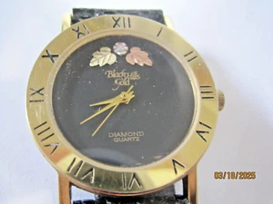 Men’s BLACK HILLS GOLD ROUND FACE DIAMOND QUARTZ WRIST WATCH LEAVES NEW BATTERY - Picture 1 of 2