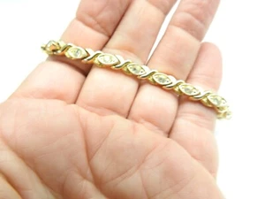 Brazalete de tenis vintage de 7 1/2 pulgadas con estrás transparente tono dorado metal X vinculado - Imagen 1 de 3
