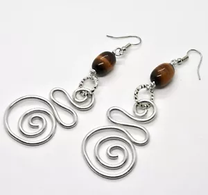 ORECCHINI IL ALLUMINIO LUNGHI 9 CM CON OCCHIO DI TIGRE E SPIRALE - Imagen 1 de 4