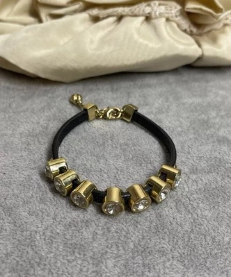 Juicy Couture Bracelet Gold Tone Crystal Black Faux Leather 6.5" Costume Jewelry - Image 1 of 4