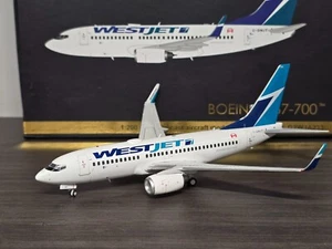 Gemini Jets 1:200 WestJet Boeing 737-700 C-GWJT G2WJA233 - Picture 1 of 6