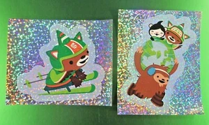 Juego de 2 pegatinas Sandylion 2010 Canadá Winter Game Mascotas - Imagen 1 de 4