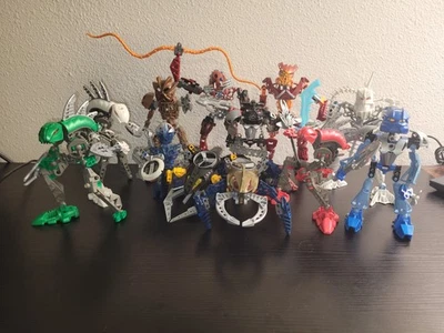 HUGE LEGO BIONICLE LOT 12 Figures, Weapons, Accessories  - Image 1 of 4