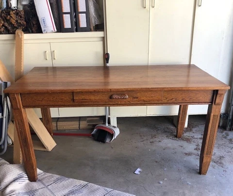 Oak mission style library table. antique. detail work on the legs. one drawer Cover