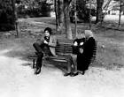 Italian actor Paolo Giusti sitting on a bench with an old woman M- 1970 Photo