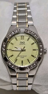 Vintage Q&Q Quartz 5 Bar Woman's watch Silver and gold band diamonds Stones - Picture 1 of 10