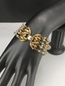 Pulsera LISNER vintage tono dorado intrincado diseño broche 6 hebras cuentas vidrio - Imagen 1 de 9
