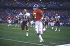 John Elway Denver Broncos carries the ball near the sideline Football 1988 Photo