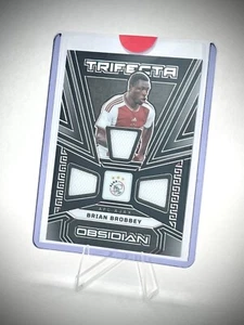 Parche Brian Brobbey 2023-24 Panini Obsidiana Fútbol Ajax Trifecta TM-BB 23/49 - Imagen 1 de 2