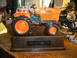 Kubota Tractor piggy bank on a platform rare - Picture 1 of 3