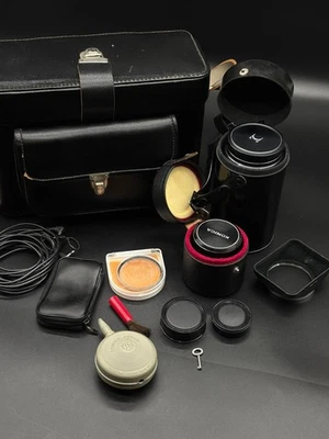 collection of vintage photography equipment, including a camera and lenses - Image 1 of 4