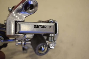 Desviador trasero vintage Suntour 7 5-7 sp acero fricción jaula larga plata nuevo nuevo de lote antiguo - Imagen 1 de 8